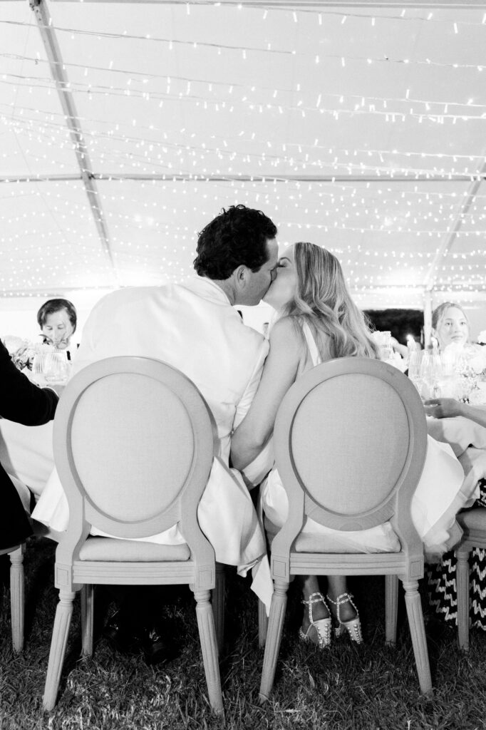 bride and groom couple kissing black and white French soirée wedding in saint Tropez